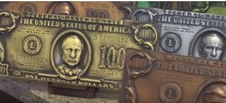 بالفيديو.. هاكر روسي يطبع صورة بوتين على الدولار الأميركي