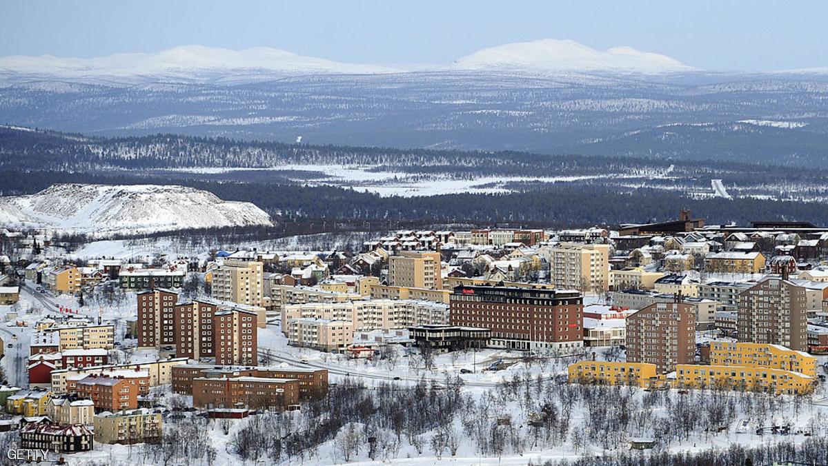 TO GO WITH AFP PHOTO BY NINA LARSON - Former excavation works are seen on the outskirts of the minning town of Kiruna on February 9, 2009. Sweden's northernmost town has long known it must relocate or sink into cracks shooting toward its centre from a century-old iron mine, but how to move an entire town, and it soul, is proving complicated. Tucked way up in the Lapland wilderness, Kiruna -- whose mine is still booming -- was founded around the world's largest known single piece of iron ore, 145 kilometres (90 miles) north of the Arctic Circle. AFP PHOTO OLIVIER MORIN (Photo credit should read OLIVIER MORIN/AFP/Getty Images)